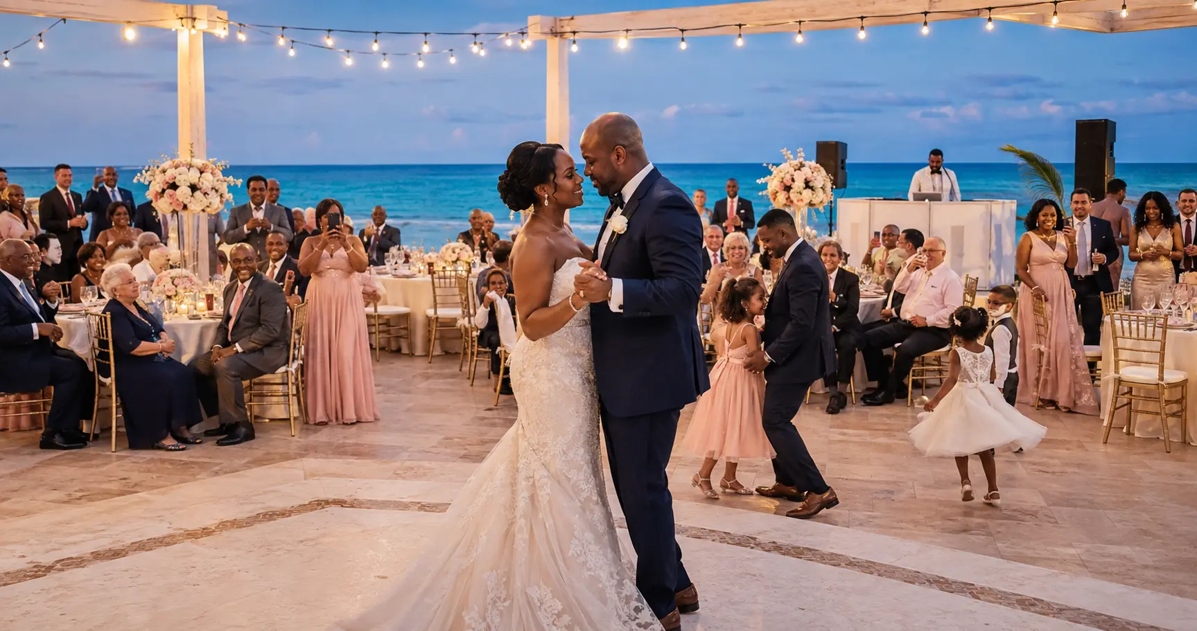 Black bride and groom dancing at an illustrative multigenerational oceanfront wedding reception
