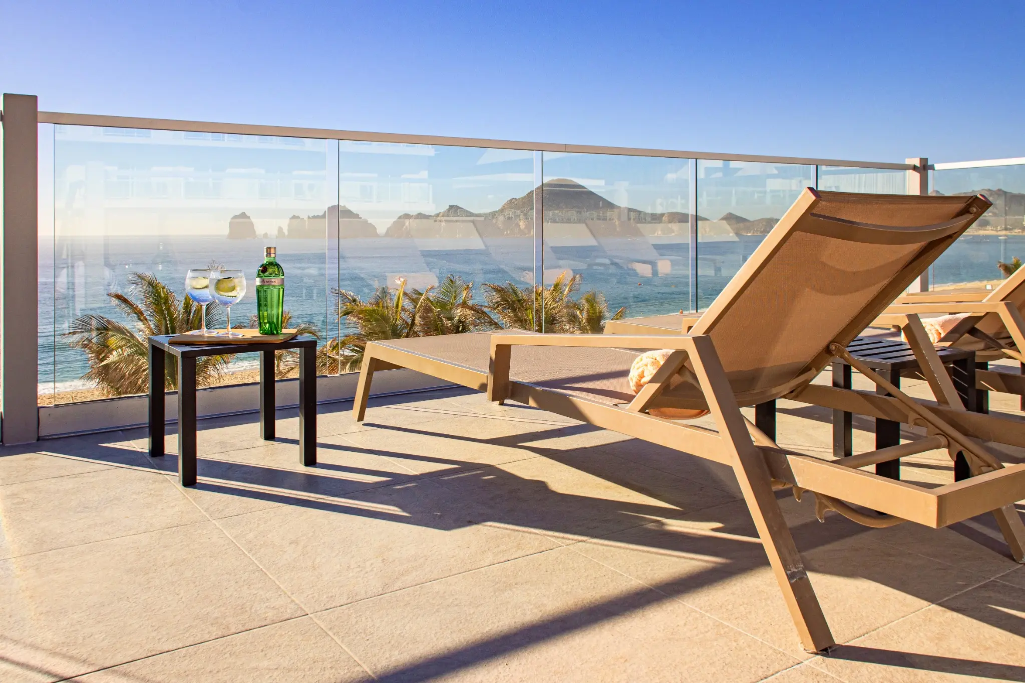 Elite Club loungers and drinks overlooking the ocean in Los Cabos