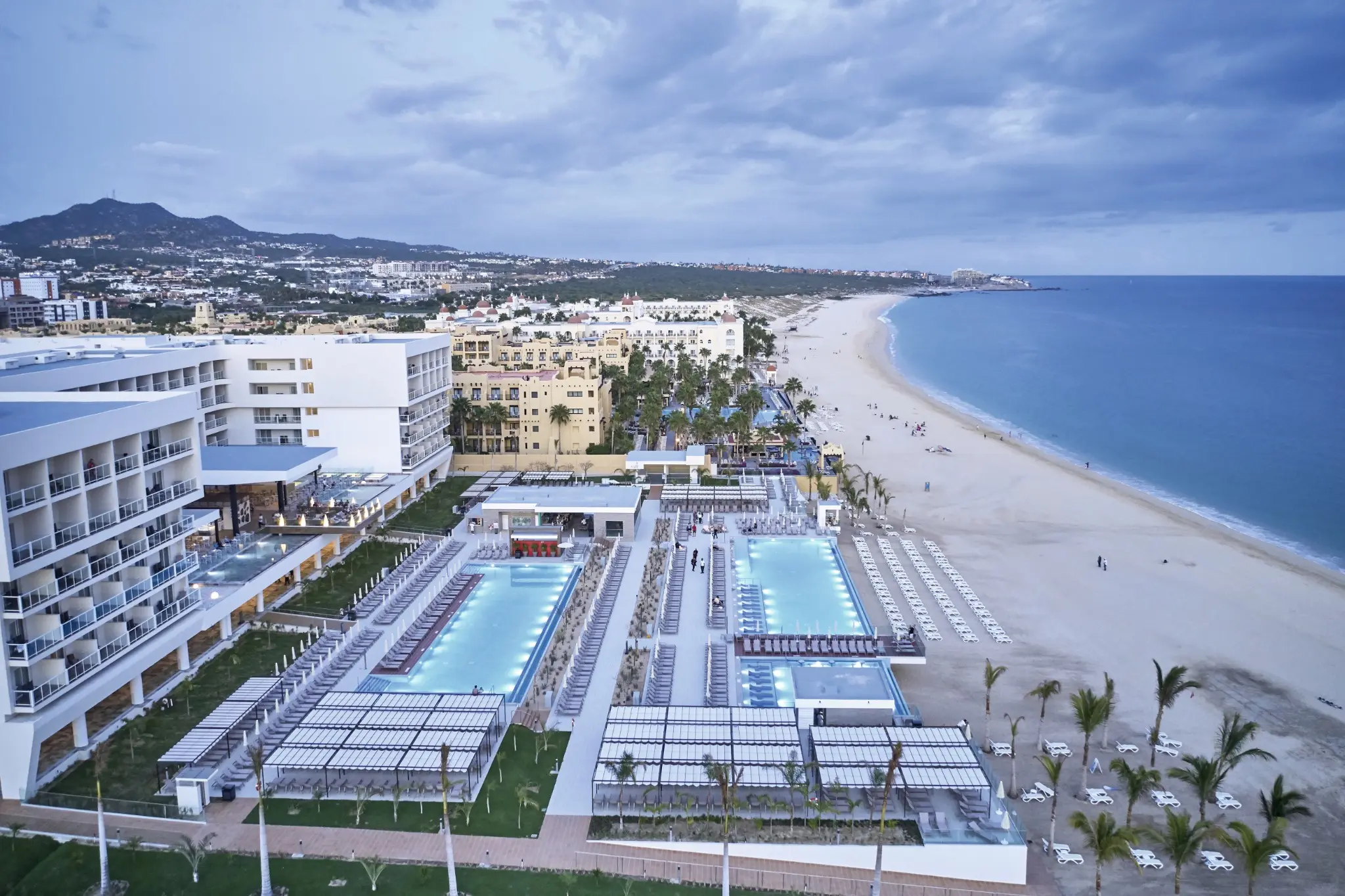 Aerial view of the pools, gardens, and coastline at RIU Palace Baja California