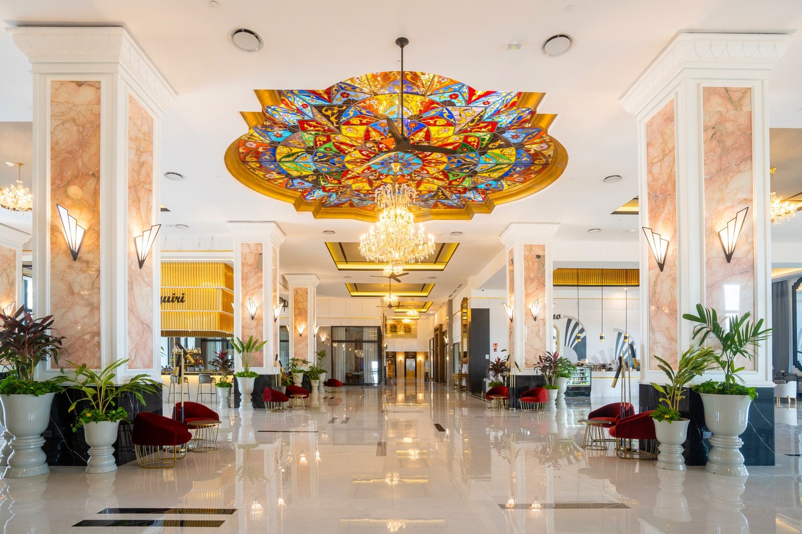 Colorful stained-glass ceiling and reception lobby at RIU Palace Pacifico