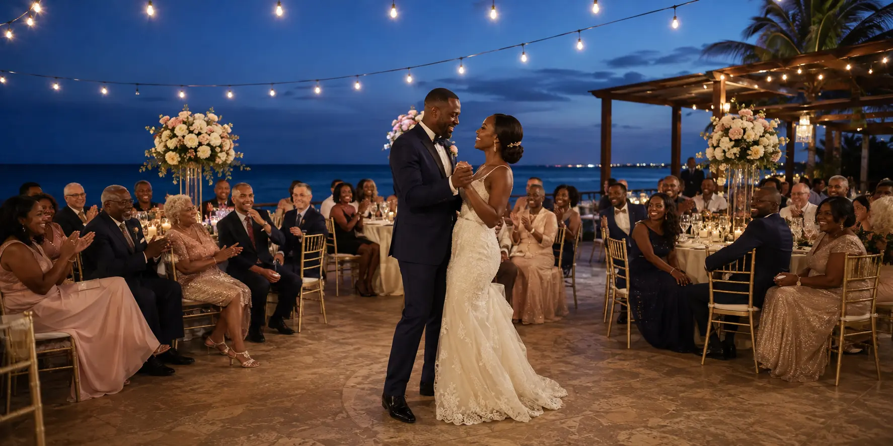 Black newlyweds sharing a first dance at an illustrative oceanfront Cancun wedding reception